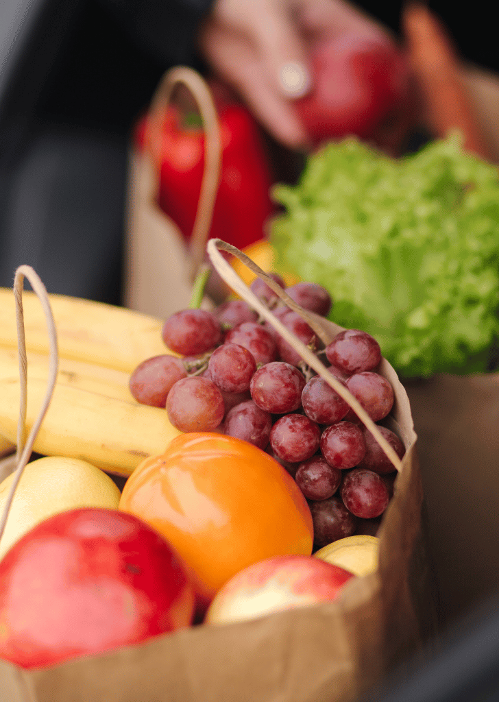 close up of healthy groceries in a brown paper bag